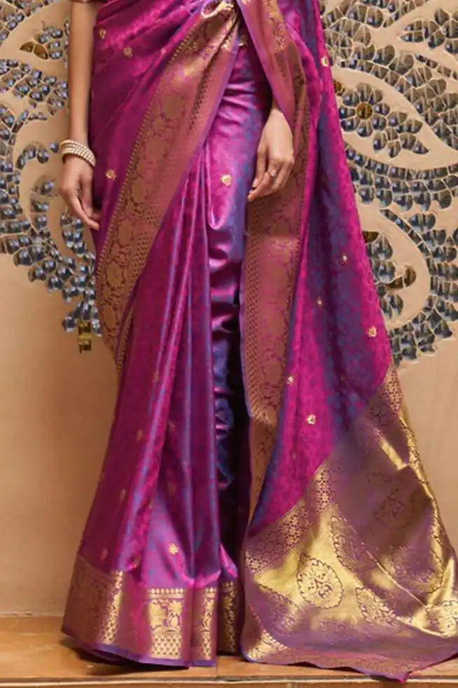 Purple saree with gold patterns on a decorative background
