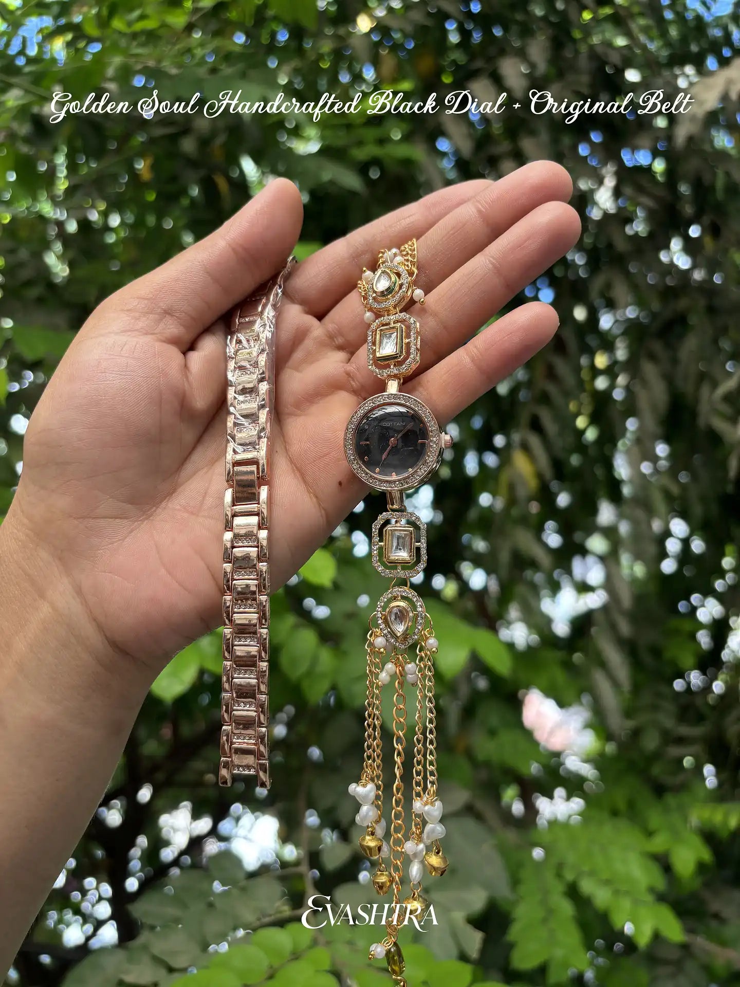 Hand holding a collection of gold and rose gold bracelets with a blurred green background